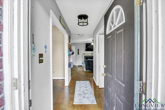 entryway featuring a textured ceiling