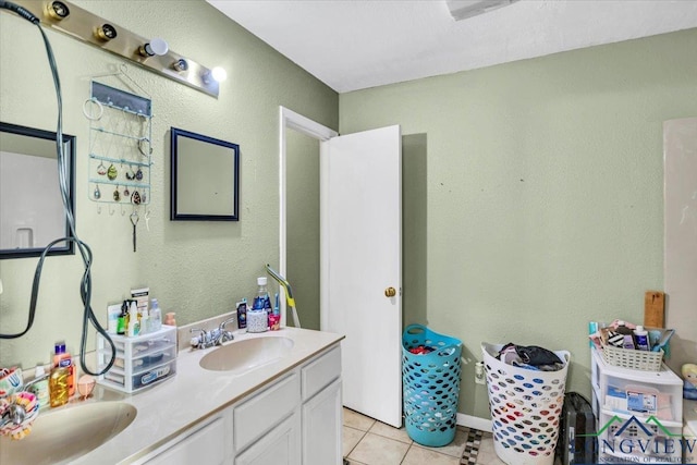 bathroom with tile patterned floors and vanity