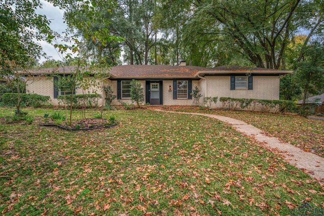 ranch-style house with a front lawn