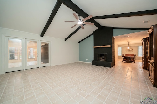 unfurnished living room with ceiling fan, a large fireplace, light tile patterned floors, and lofted ceiling with beams