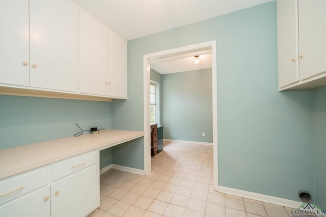 clothes washing area featuring light tile patterned floors