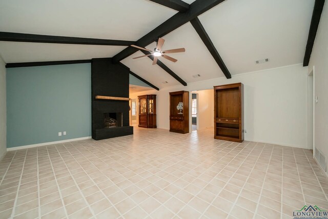 unfurnished living room with vaulted ceiling with beams, ceiling fan, and a large fireplace