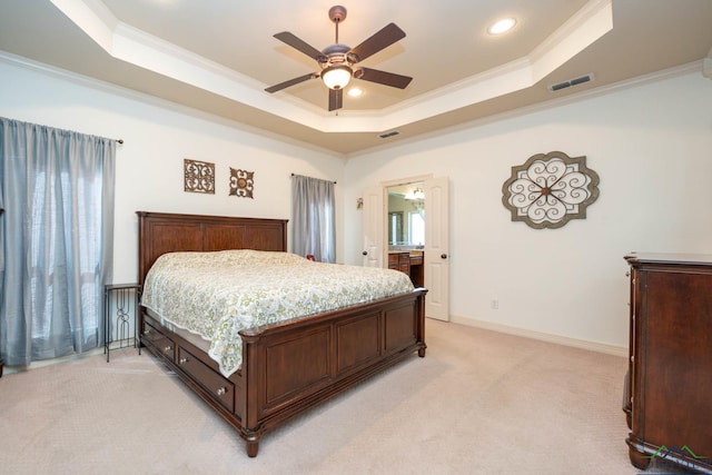 bedroom with light carpet, baseboards, visible vents, ornamental molding, and a tray ceiling