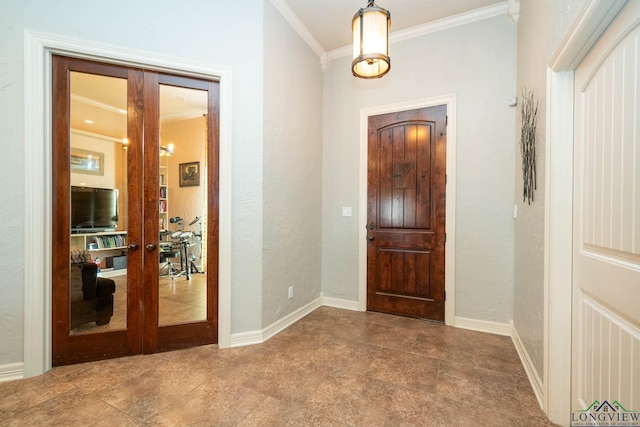 entryway featuring baseboards, ornamental molding, and french doors