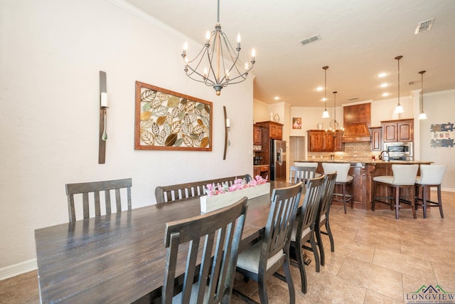 dining space with recessed lighting, visible vents, crown molding, and a notable chandelier