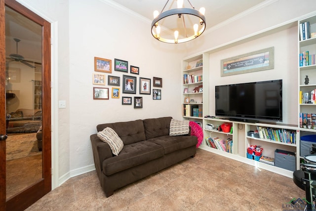 living area with built in shelves, a chandelier, ornamental molding, and baseboards