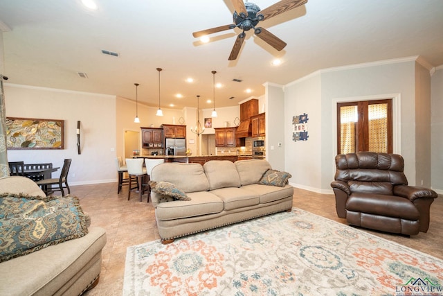 living room featuring ornamental molding, visible vents, and baseboards