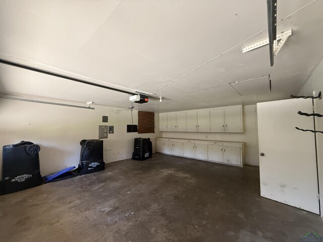 1705 Hyacinth Dr, Longview, TX 75601 - garage featuring a garage door opener and electric panel