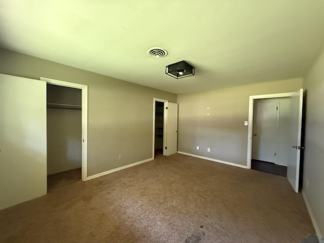 1705 Hyacinth Dr, Longview, TX 75601 - unfurnished bedroom featuring carpet flooring and two closets