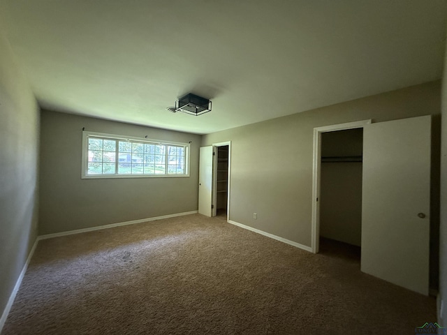1705 Hyacinth Dr, Longview, TX 75601 - unfurnished bedroom featuring carpet flooring and two closets