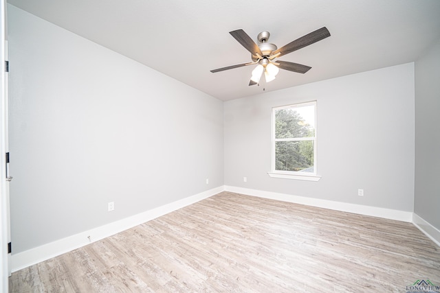 empty room featuring ceiling fan and light wood-type flooring