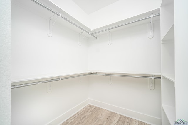 walk in closet featuring light hardwood / wood-style floors