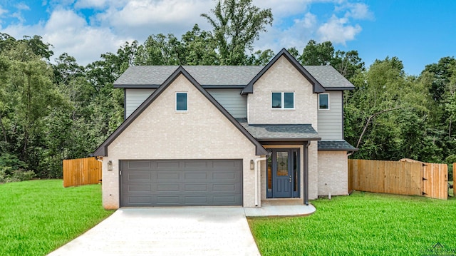 view of front of house featuring a front yard and a garage