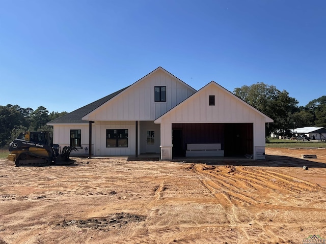 modern farmhouse style home featuring a garage