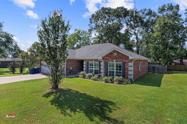 view of front of property with a front lawn and a garage