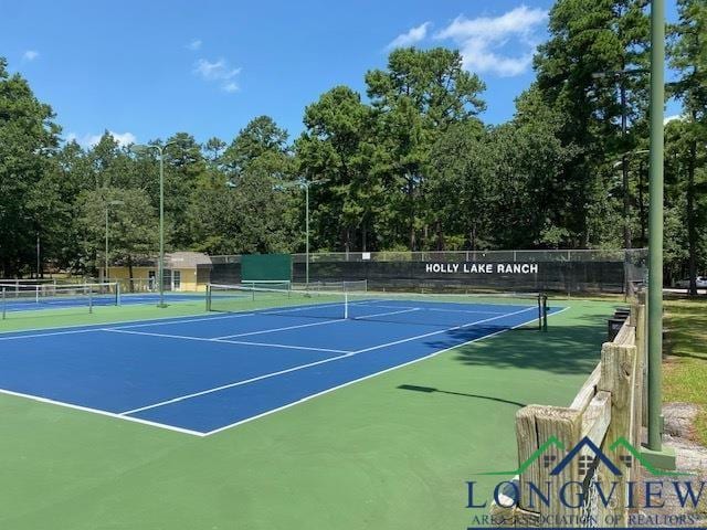 view of sport court featuring community basketball court and fence
