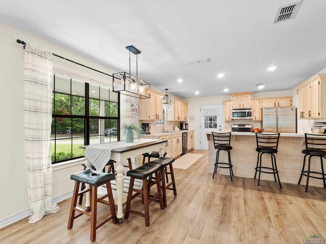 dining room featuring visible vents, recessed lighting, and light wood-type flooring