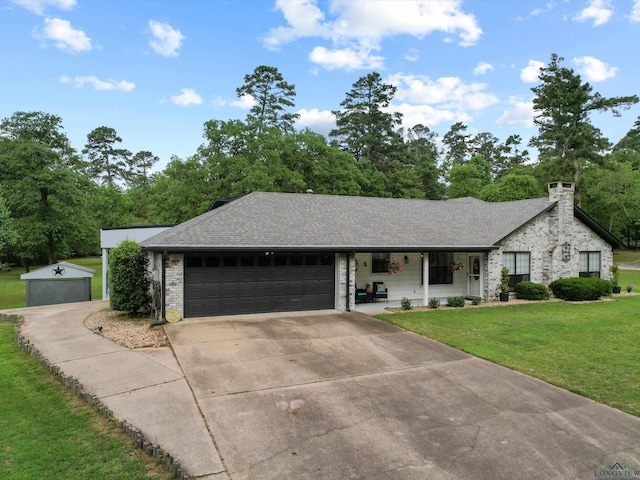 ranch-style house with a front lawn, a chimney, a shingled roof, concrete driveway, and an attached garage