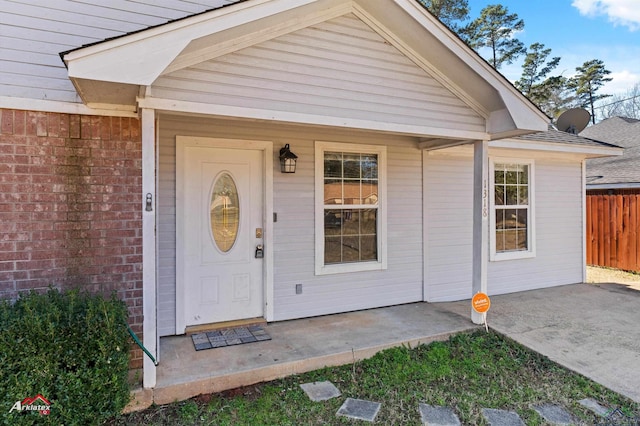 entrance to property featuring a patio