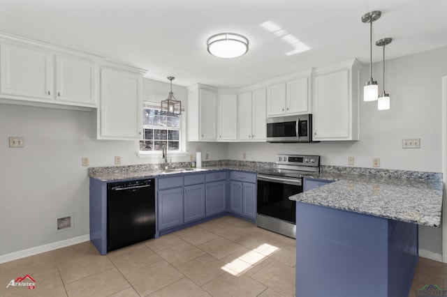 kitchen featuring pendant lighting, appliances with stainless steel finishes, sink, and white cabinets