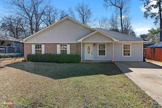 single story home featuring a front lawn