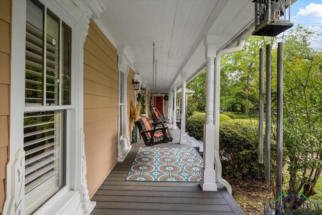wooden deck featuring a porch