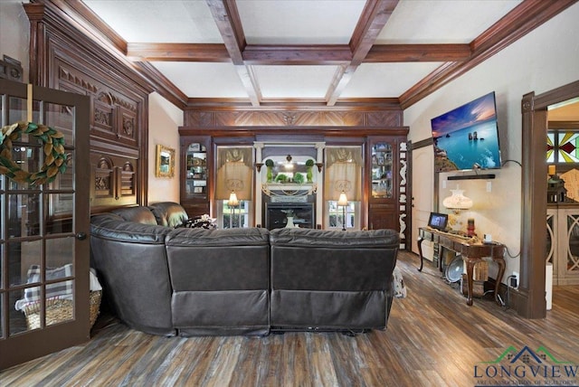 living room featuring beam ceiling, coffered ceiling, and wood finished floors