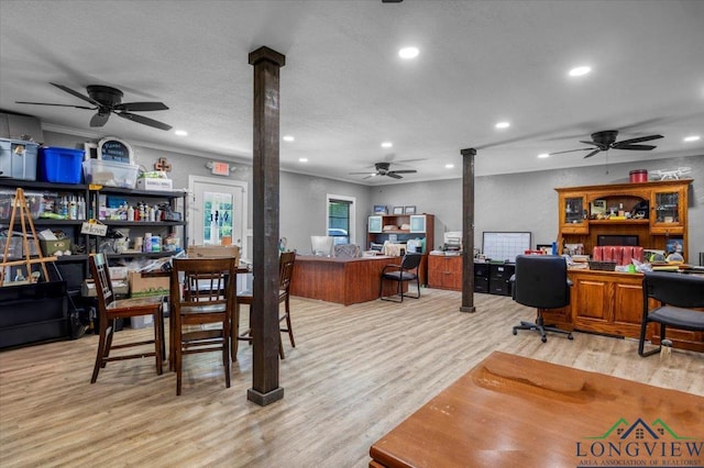 office space featuring ceiling fan, ornate columns, light wood-style flooring, recessed lighting, and crown molding