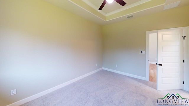 2510 Windmill Ln, Longview, TX 75601 - unfurnished room with a ceiling fan, light colored carpet, baseboards, and a raised ceiling