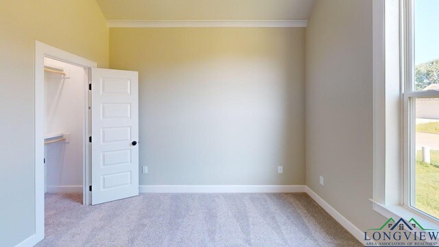 2510 Windmill Ln, Longview, TX 75601 - carpeted empty room with ornamental molding, plenty of natural light, and baseboards