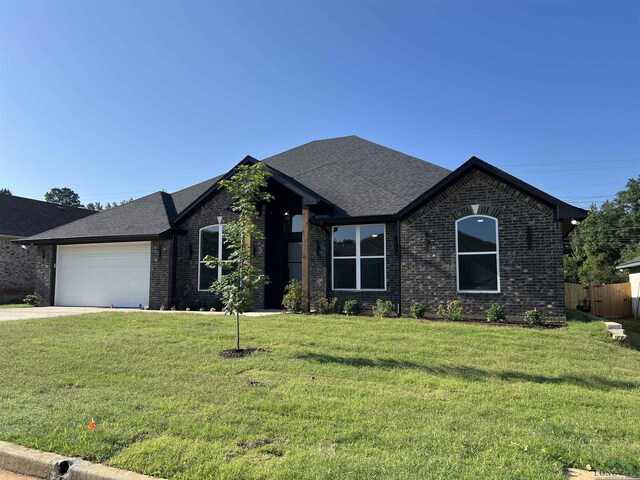 2510 Windmill Ln, Longview, TX 75601 - ranch-style house with brick siding, a garage, concrete driveway, and a shingled roof