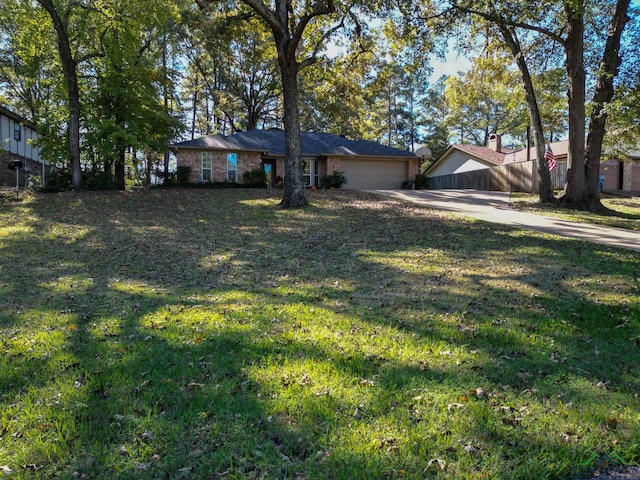 view of front of house featuring a front yard and a garage