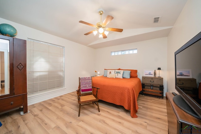 bedroom featuring ceiling fan, lofted ceiling, and light hardwood / wood-style flooring