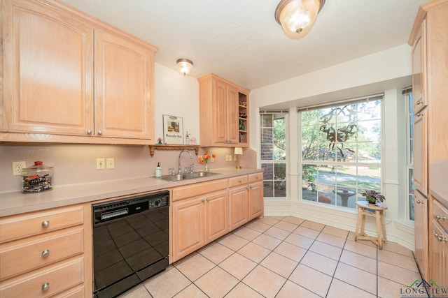 kitchen featuring dishwasher, light brown cabinets, light tile patterned floors, and sink