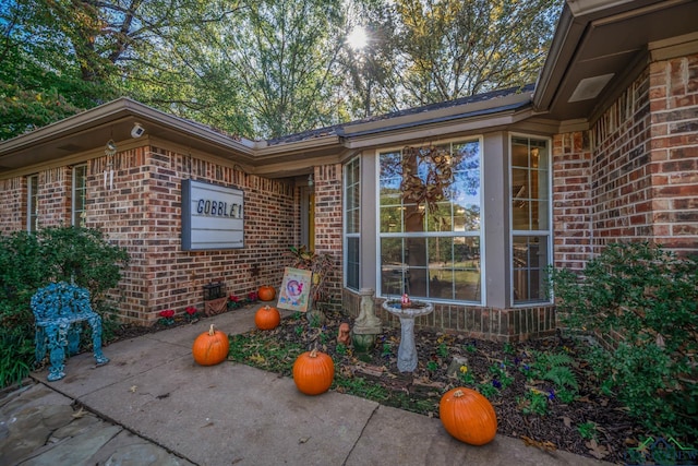 property entrance with a patio