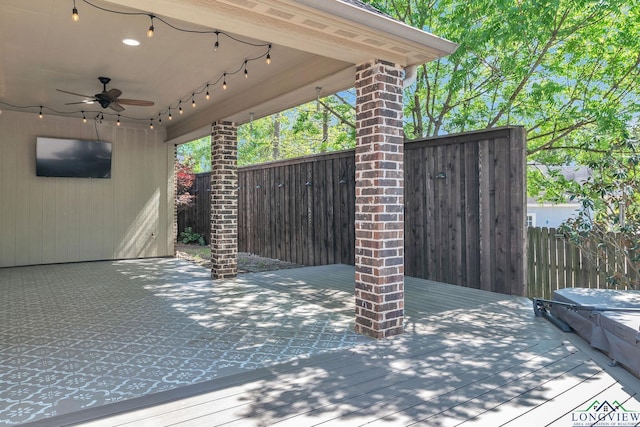 view of patio / terrace featuring a ceiling fan, fence, and a deck