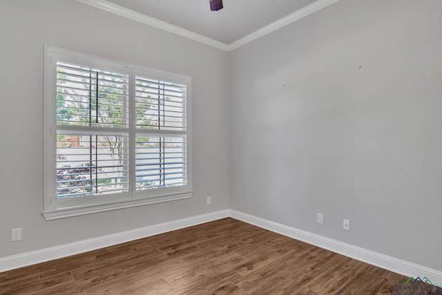 empty room featuring baseboards, a ceiling fan, wood finished floors, and crown molding
