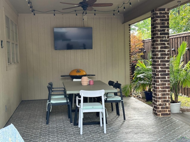 view of patio featuring fence private yard, outdoor dining area, and ceiling fan