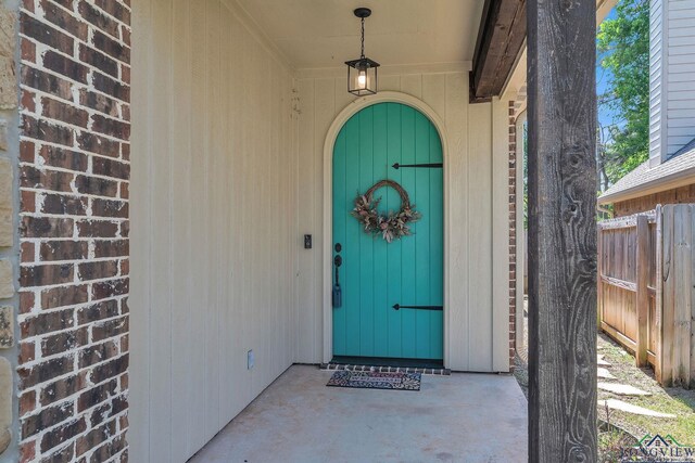property entrance featuring fence