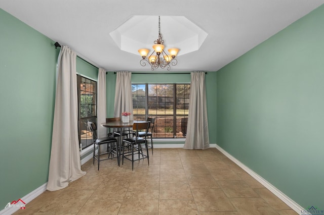 unfurnished dining area featuring a notable chandelier