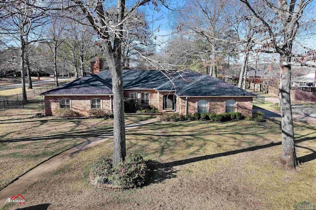 ranch-style house with a front lawn