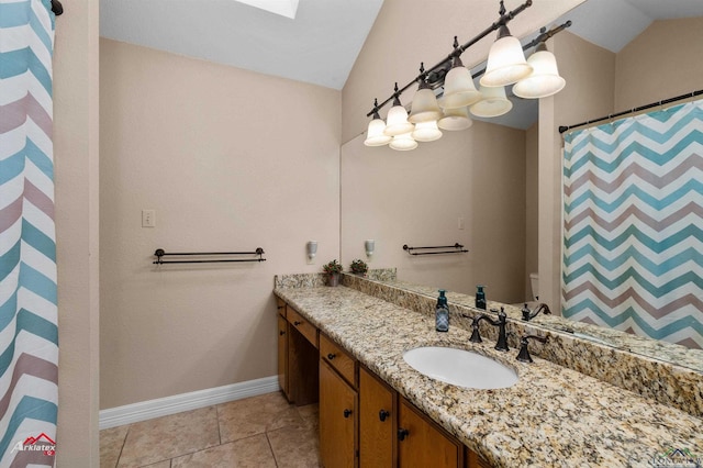 bathroom with tile patterned floors, vanity, vaulted ceiling, and a shower with curtain