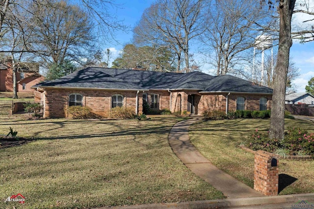 single story home with a front lawn