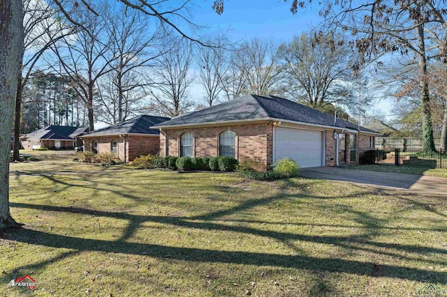 view of side of property featuring a garage and a yard