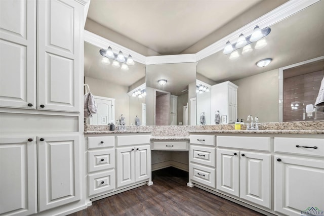 bathroom with vanity and wood-type flooring