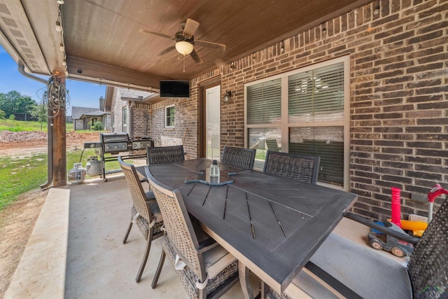 view of patio / terrace featuring area for grilling and ceiling fan