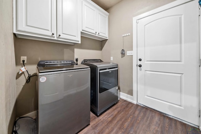 laundry room with dark hardwood / wood-style floors, cabinets, and separate washer and dryer