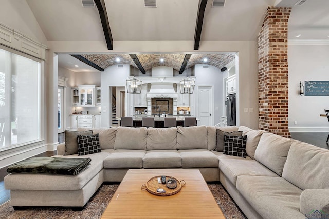 living room featuring brick ceiling, vaulted ceiling with beams, and dark hardwood / wood-style floors