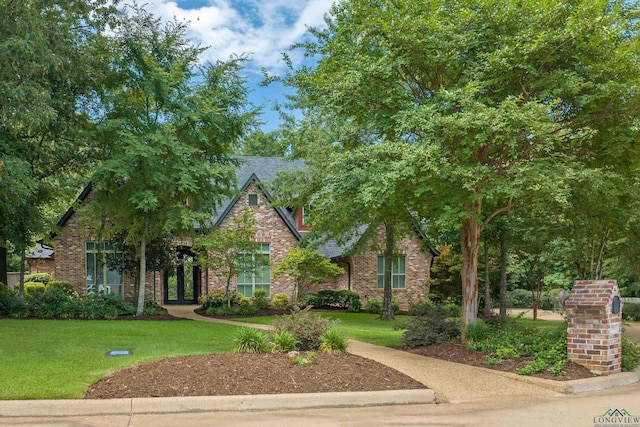 view of front of home with a front lawn