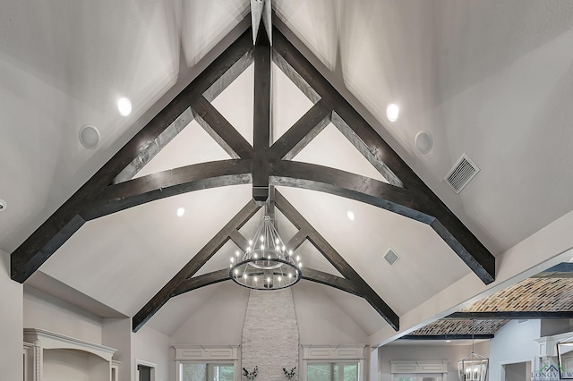 details with beam ceiling and a notable chandelier